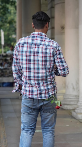 A boy with rose in his pocket going to purpose her Girlfriend Surprise image love CP New Delhi Delhi India 14 Jan 2023