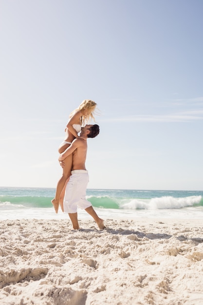 Boyfriend lifting his girlfriend