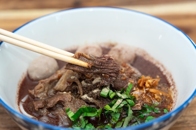 Braised beef clear noodle with meat ball soup stew