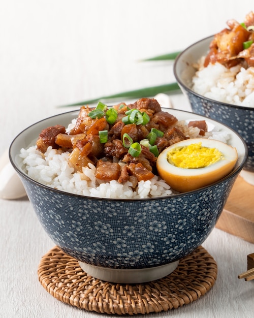 Braised meat rice, close up of stewed pork over cooked rice in Taiwan. Taiwanese famous traditional street food delicacy.