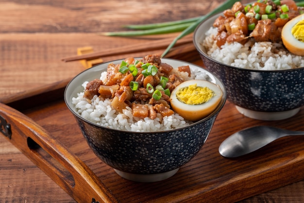 Braised meat rice, close up of stewed pork over cooked rice in Taiwan. Taiwanese famous traditional street food delicacy.