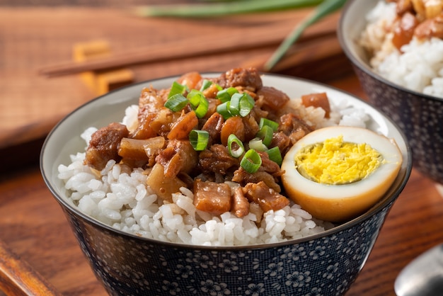 Braised meat rice, close up of stewed pork over cooked rice in Taiwan. Taiwanese famous traditional street food delicacy.