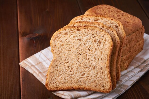 Bran bread on brown background