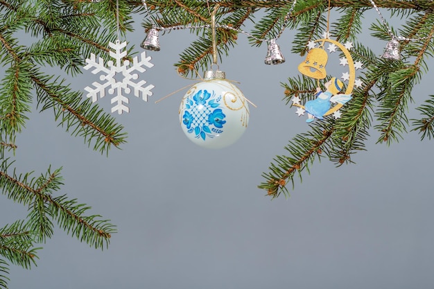 Branches of fir tree with Christmas ornament