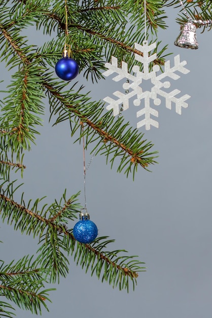 Branches of fir tree with Christmas ornament