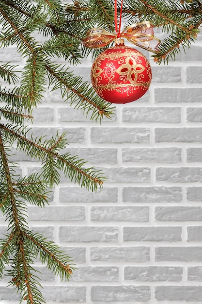 Branches of fir tree with Christmas ornament