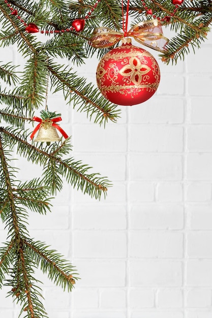 Branches of fir tree with Christmas ornament