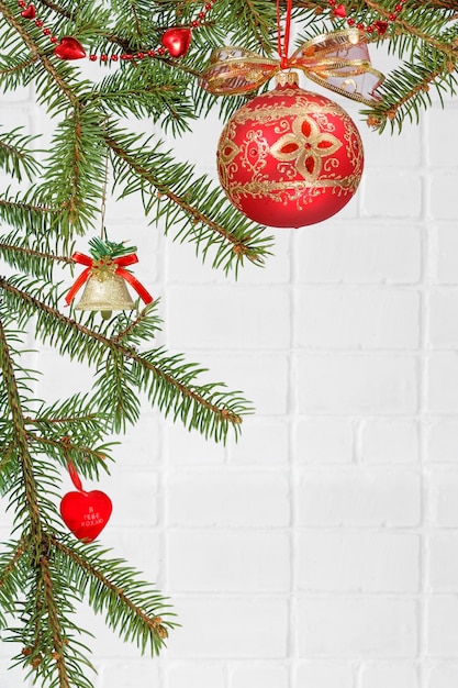 Branches of fir tree with Christmas ornament