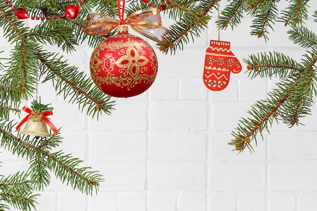 Branches of fir tree with Christmas toy ball and ornament