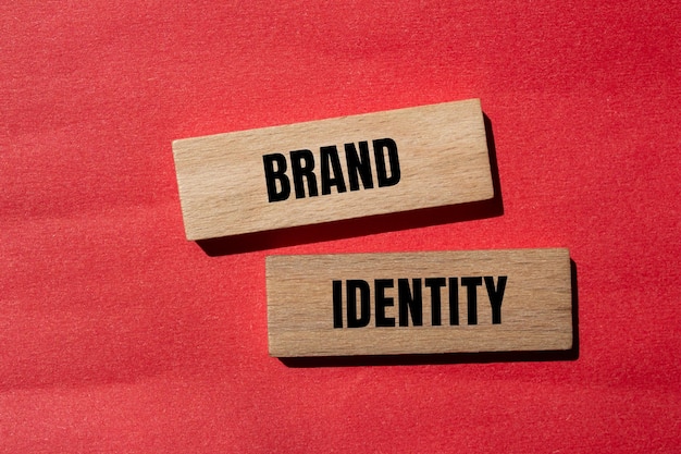 Brand identity words written on wooden blocks with red background Conceptual business brand identity symbol Copy space