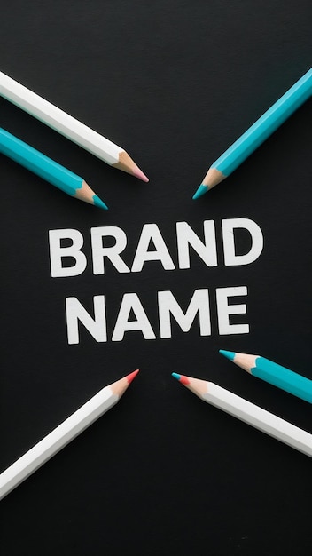 Photo brand name written over black paper background with white and blue wooden colored pencils