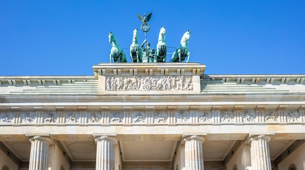 Brandenburg Gate In Berlin Historic symbol in Germany Clear blue sky background