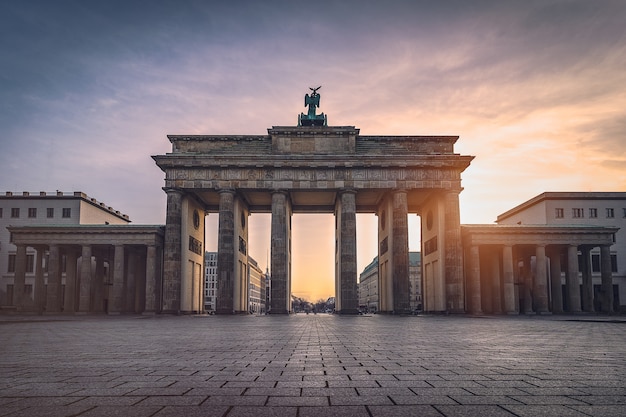 Brandenburg gate illuminated at sunset front view