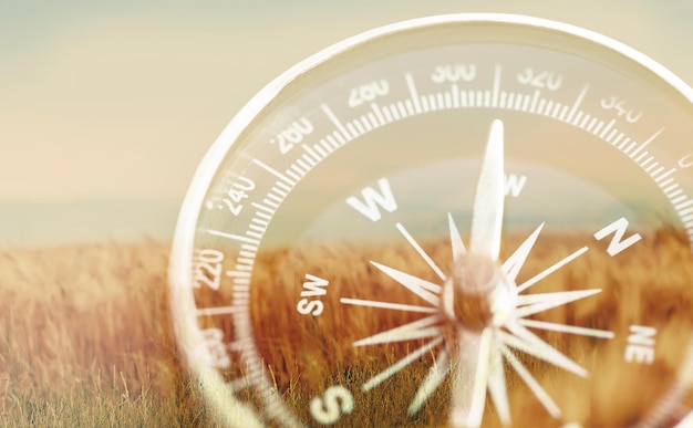 Brass antique compass  on background