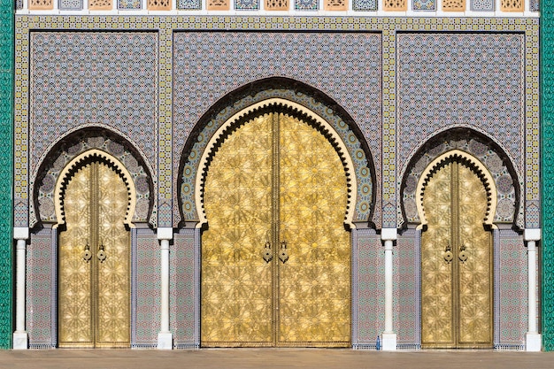 Brass gate and zellige mosaic tilework on Dar alMakhzen or Dar elMakhzen royal palace in Fez Morocco