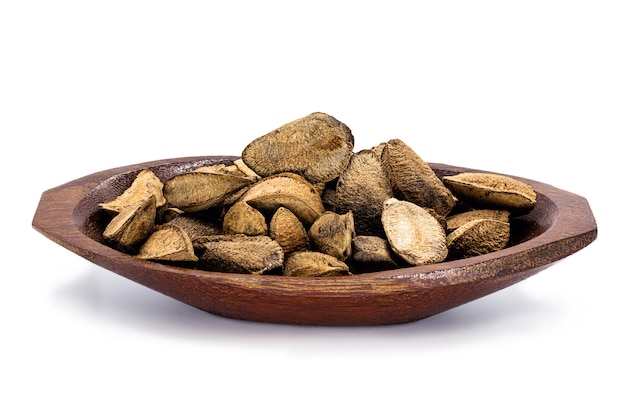 Brazil nut with shell on white background, typical Brazil nut