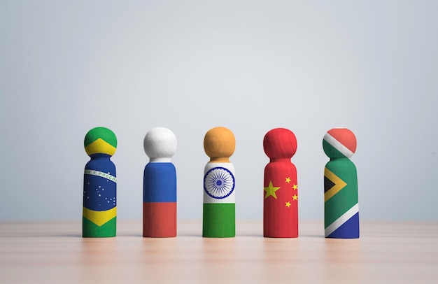 Brazil Russia India China and South Africa flag print screen on wooden figure for BRICS economic international cooperation concept