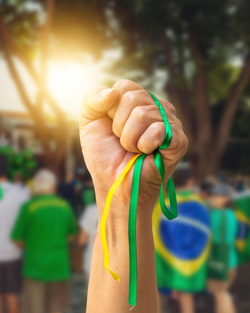 Brazil's Independence Day Mature Woman with Gray Hair Holding Brazil Flag on Cinematic Background