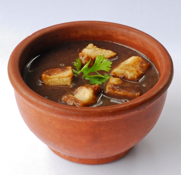 Brazilian bean broth in a clay bowl Brazilian feijoada