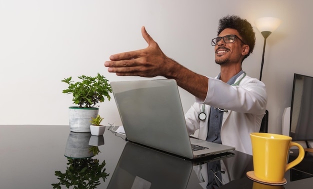 Brazilian Black Doctor or Veterinarian Working at Home Young Man During the day at desk With Laptop