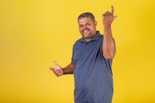 Brazilian black man adult smiling looking at camera celebrating