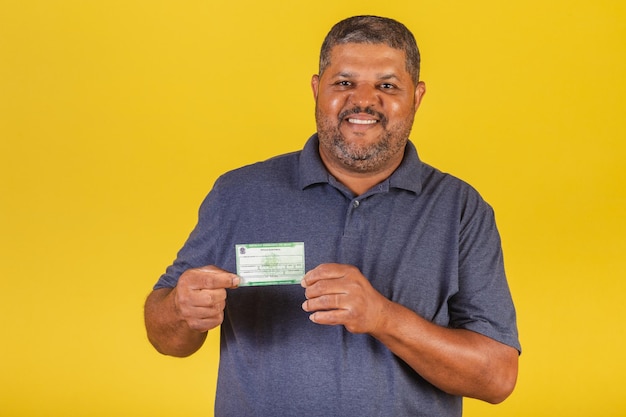 Brazilian black man adult with voter registration election document democracy