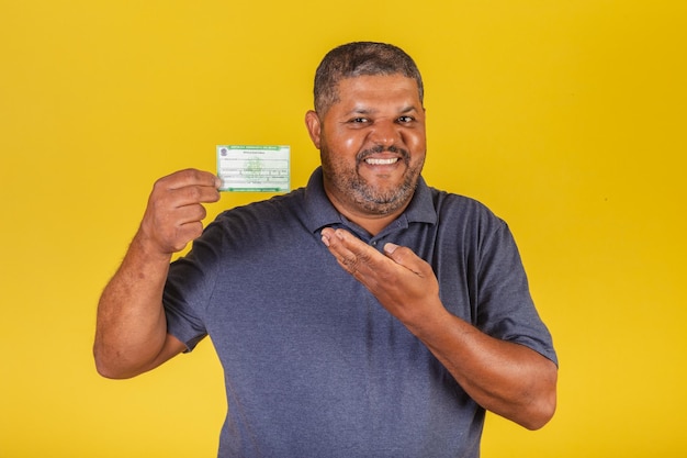 Brazilian black man adult with voter registration election document democracy