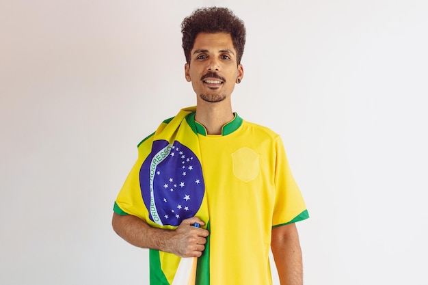 Brazilian Black Man Fan with Soccer Team Shirt Isolated on White