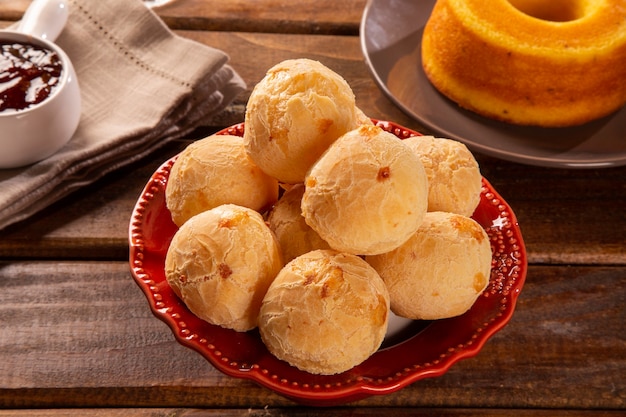 Brazilian cheese buns . Table coffee in the morning with cheese bread in basket.