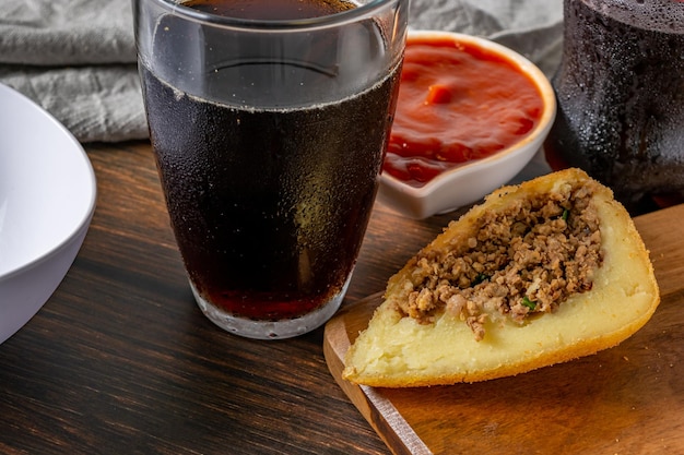 brazilian coxinha cut in half stuffed with meat