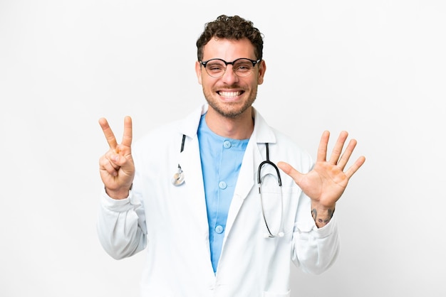 Brazilian doctor man over isolated white background counting seven with fingers