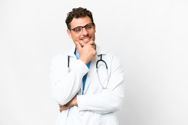 Brazilian doctor man over isolated white background looking to the side