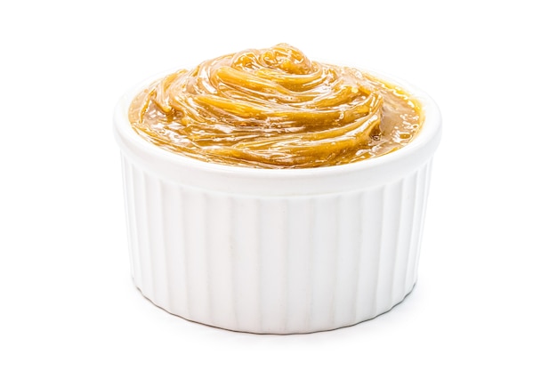 Brazilian dulce de leche, type of milk cream and pasty caramel, isolated white background