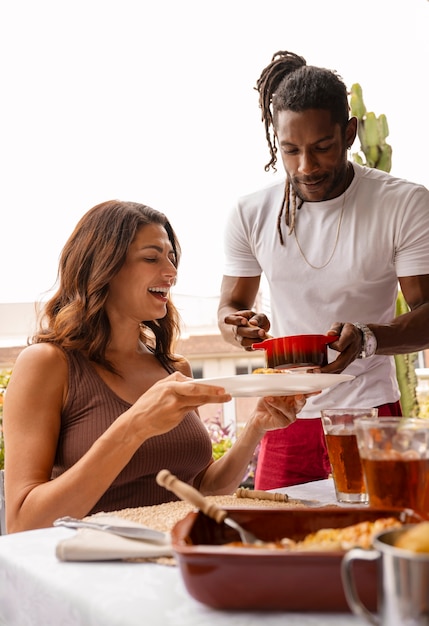 Brazilian family enjoying meal together