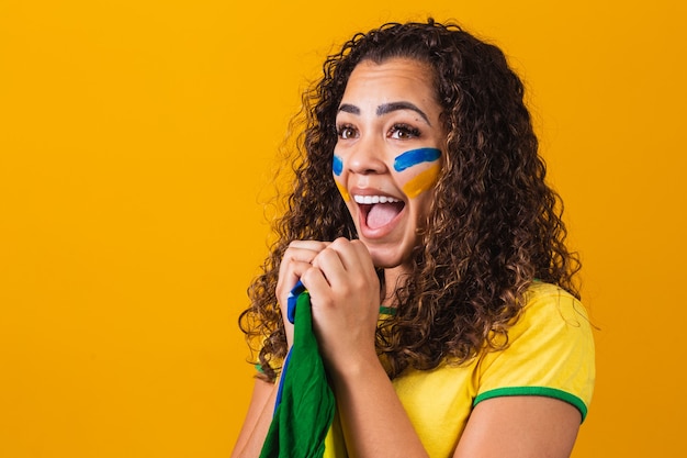 Brazilian fan with her face painted in blue and yellow for the brazil game. Brazilian celebrating the independence of Brazil. September 7th