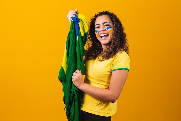 Brazilian fan with her face painted in blue and yellow for the brazil game. Brazilian celebrating the independence of Brazil. September 7th