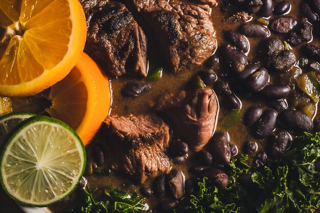 Brazilian Feijoada focusing on the rich dark stew with black beans pork and beef