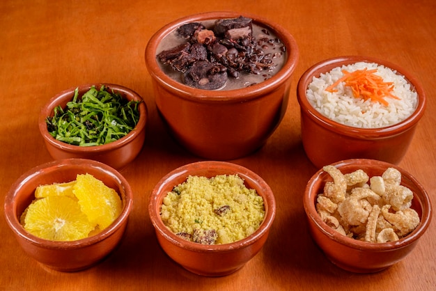 Brazilian feijoada Food made with black beans pork and sausage with traditional side dishes