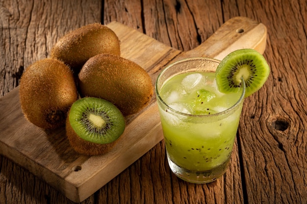 Brazilian Kiwi Caipirinha Cachaca drink with kiwi on wooden background