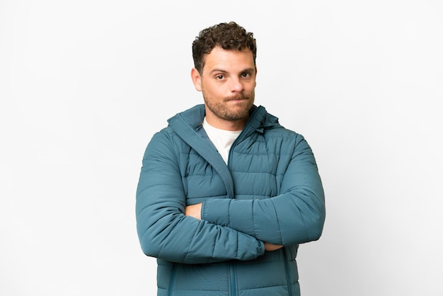 Brazilian man over isolated white background feeling upset