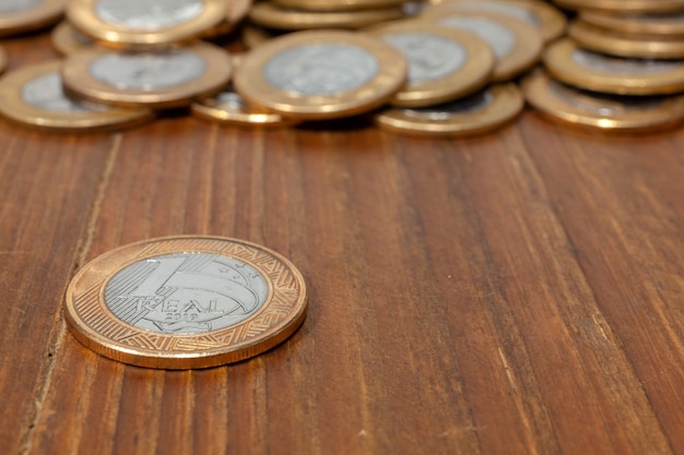 Brazilian Real coin on a wood table