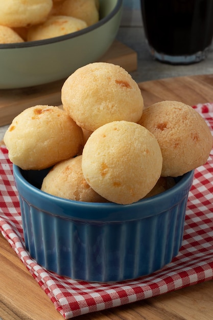 Brazilian snack cheese bread or pao de queijo in a blue bowl