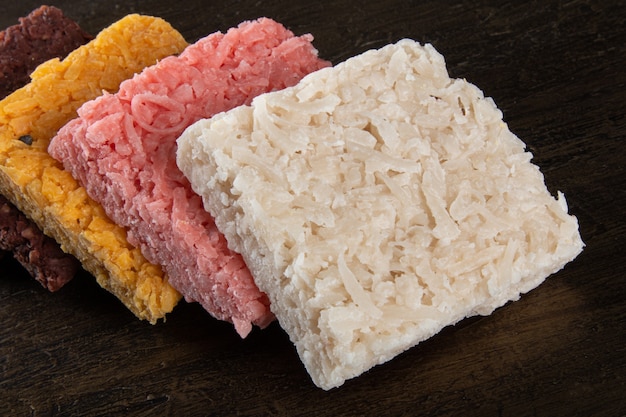 Brazilian sweet coconut candy on rustic wood