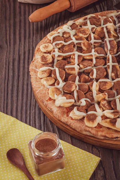 Brazilian sweet pizza with banana, condensed milk and cinnamon.