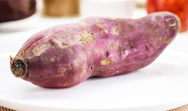 Brazilian sweet potato on rustic wooden table tuber called potato of the land potato of the island jatica and jetica