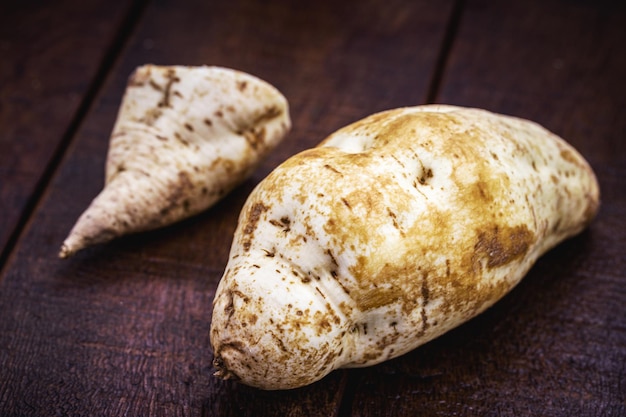 Brazilian sweet potato on rustic wooden table tuber