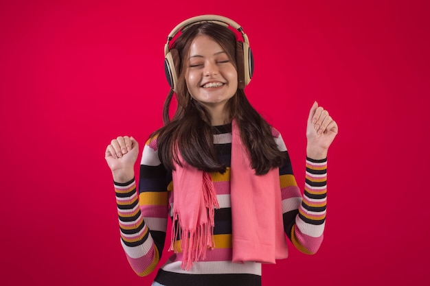 Brazilian teenager in studio wearing warm clothes and with various facial expressions