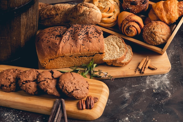 Bread and cookies with chocolates on a concrete table