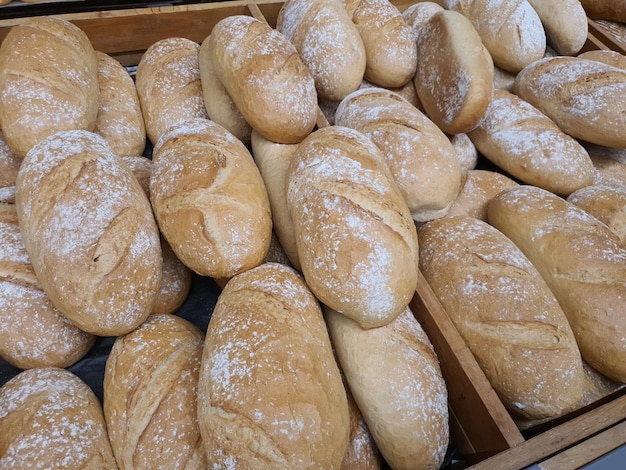 Bread loafs in bakery in bakery or grocery store Freshly baked in shopping display closeup