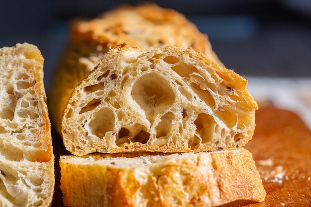 Bread macro. Bread pores. Fresh baguette with grains macro.Bakery advertisement. Seeds in bread.